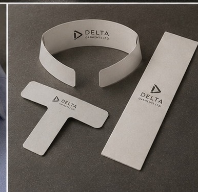 Delta Garments collar band and packaging inserts laid flat