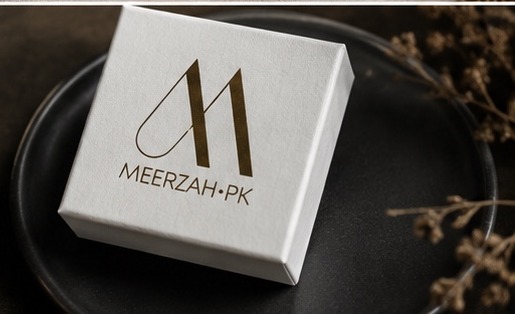 Meerzah.pk box on dark ceramic plate